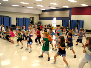 Kids learning karate in school